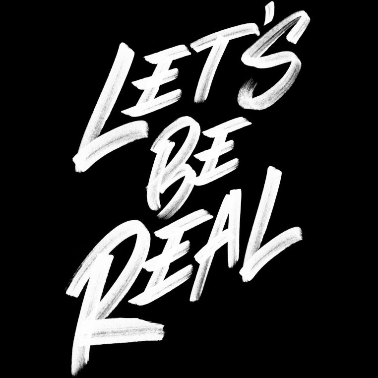Let's be real written in white brushstrokes